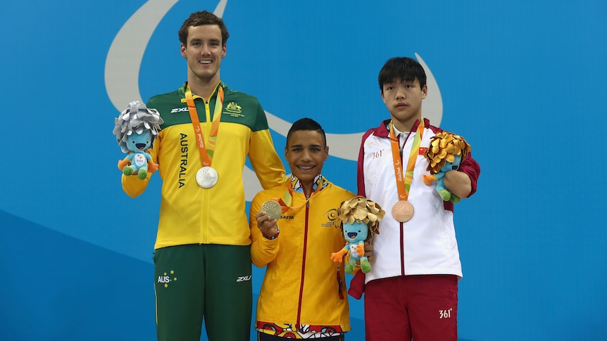 Australia's Blake Cochrane holds his silver medal after the men's 100m breaststroke SB7 final at the Rio Paralympics