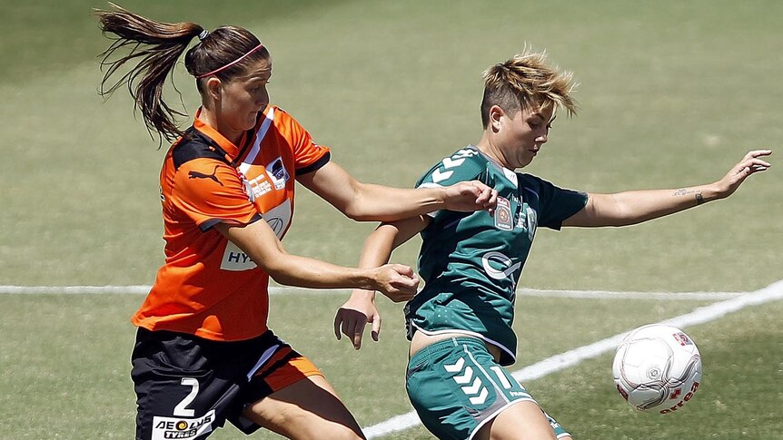 Canberra United's Michelle Heyman and Brisbane Roar's Laura Alleway contest possession during the 2012 W-League Grand Final.