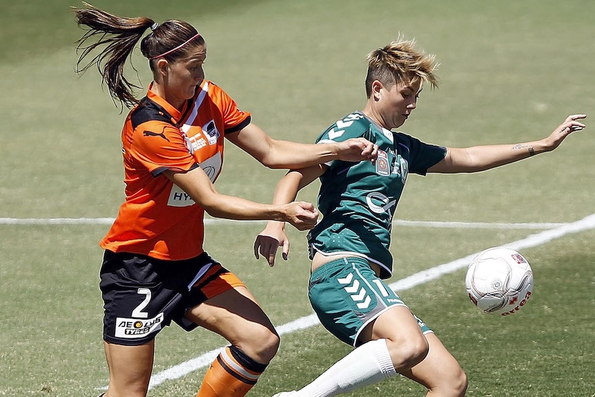 Canberra United's Michelle Heyman and Brisbane Roar's Laura Alleway contest possession during the 2012 W-League Grand Final.