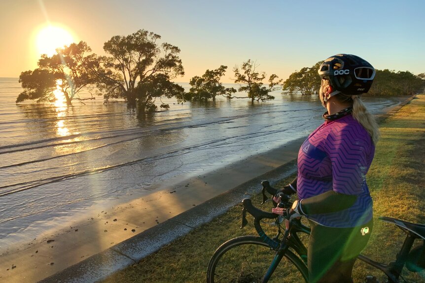 Lisa watches the sunrise over Nudgee Beach.