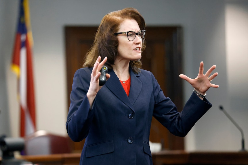 Prosecutor Linda Dunikoski gestures with her hands speaking in court at the Ahmaud Arbery murder trial. 