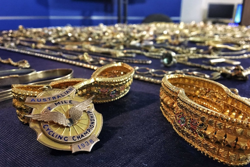 Hundreds of pieces of stolen jewellery, including a cycling pendant.