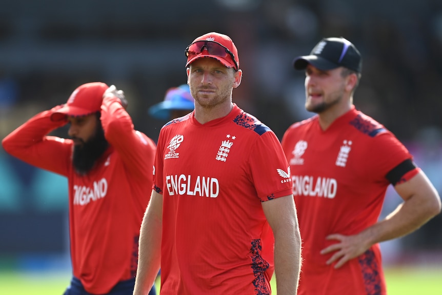 Jos Buttler leads England off after losing to India