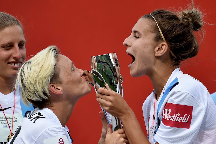 Melbourne City players celebrate winning the W-League title