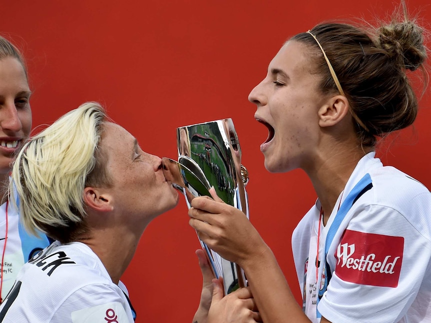 Melbourne City players celebrate winning the W-League title