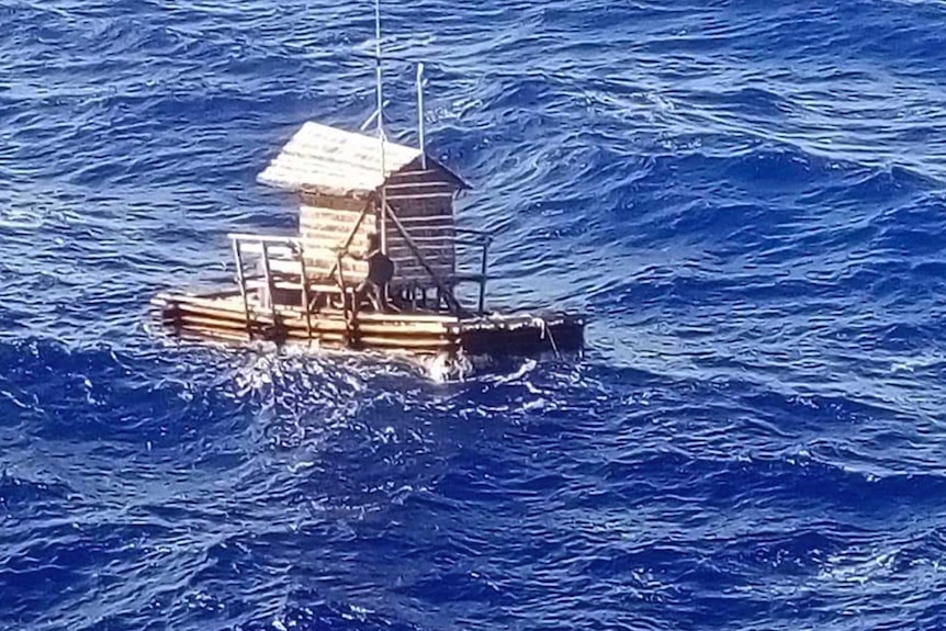 The teenager is seen on a wooden fish trap floating in the sea.