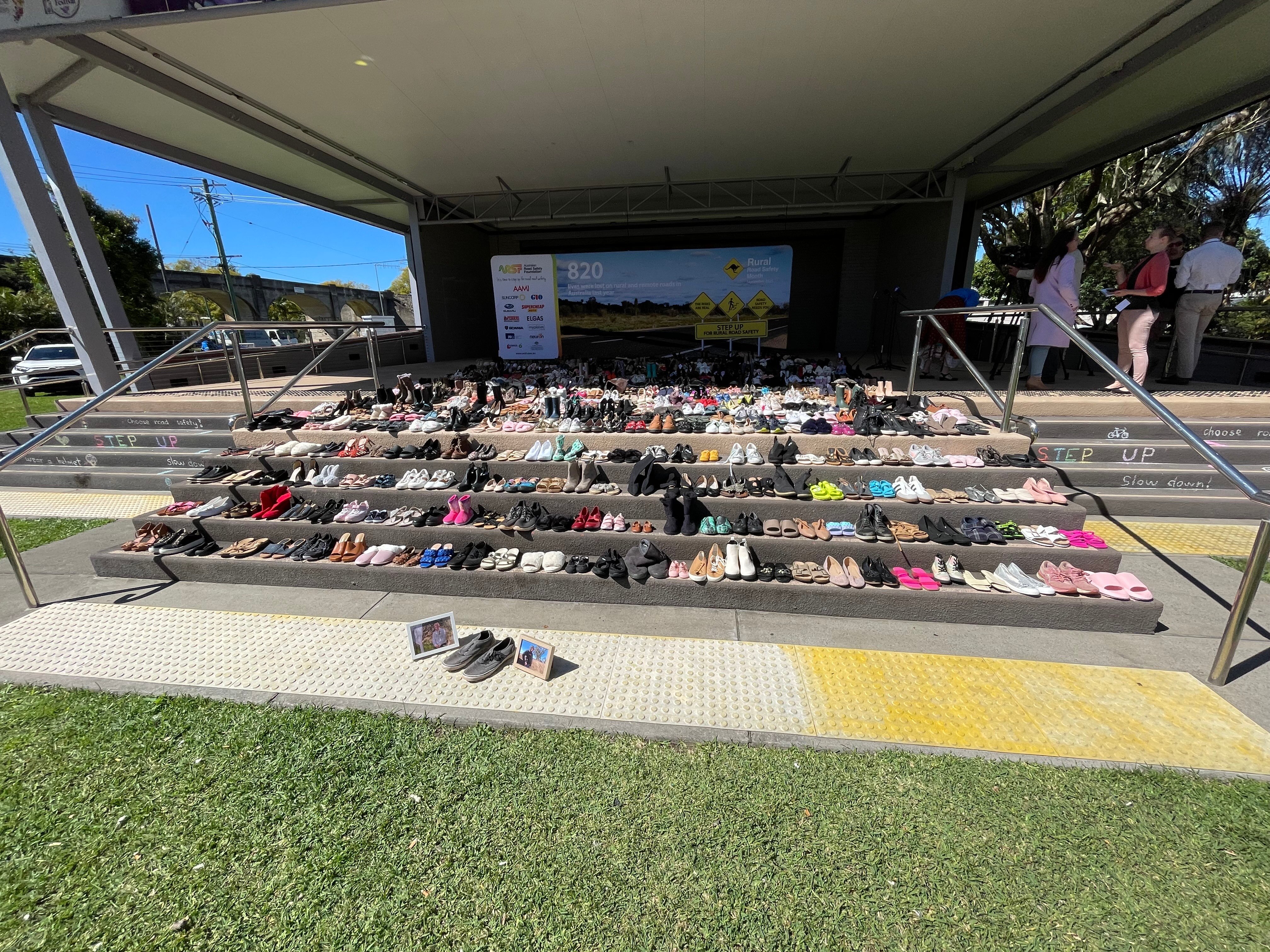 A staircase covered in rows of shoes.