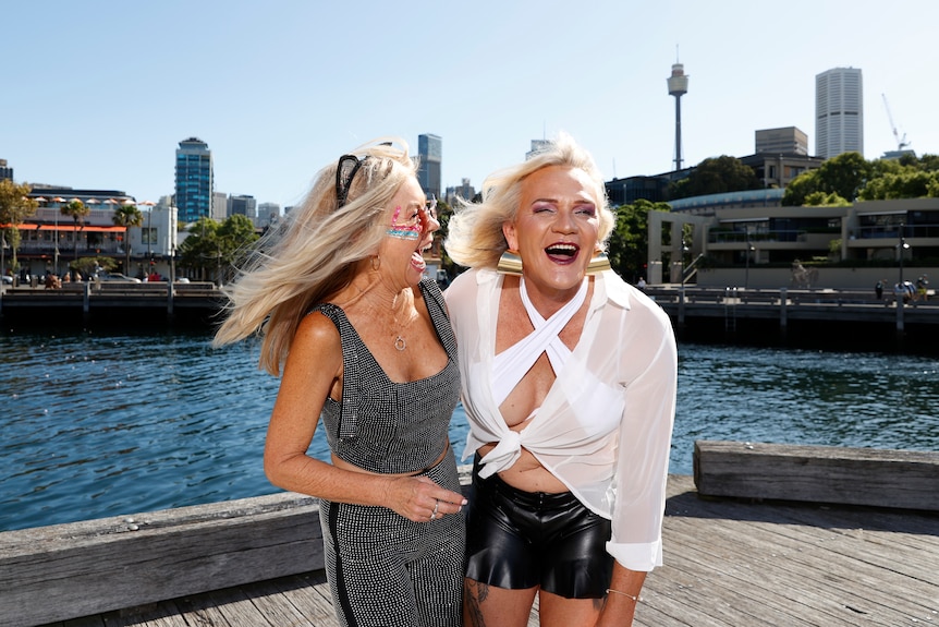 Danielle Laidley laughing with her arm around partner Donna Leckie.