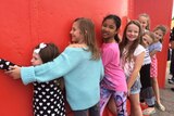 Kids embrace Geraldton lighthouse