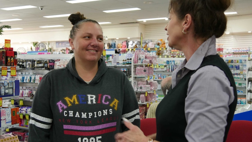 George Town resident Sarah Napier talking to her pharmacist about quitting smoking.