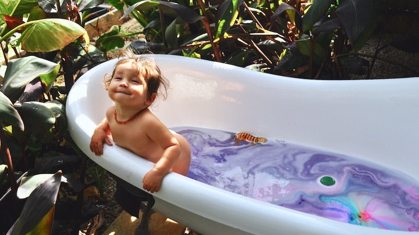 Baby Emilia enjoys a cool bath in her Port Willunga backyard.