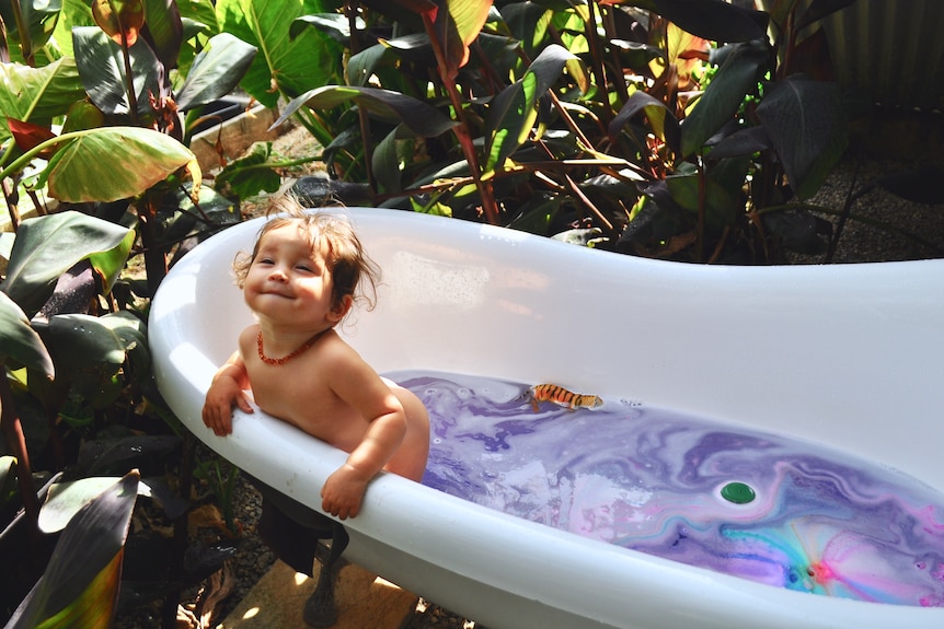 Baby Emilia enjoys a cool bath in her Port Willunga backyard.