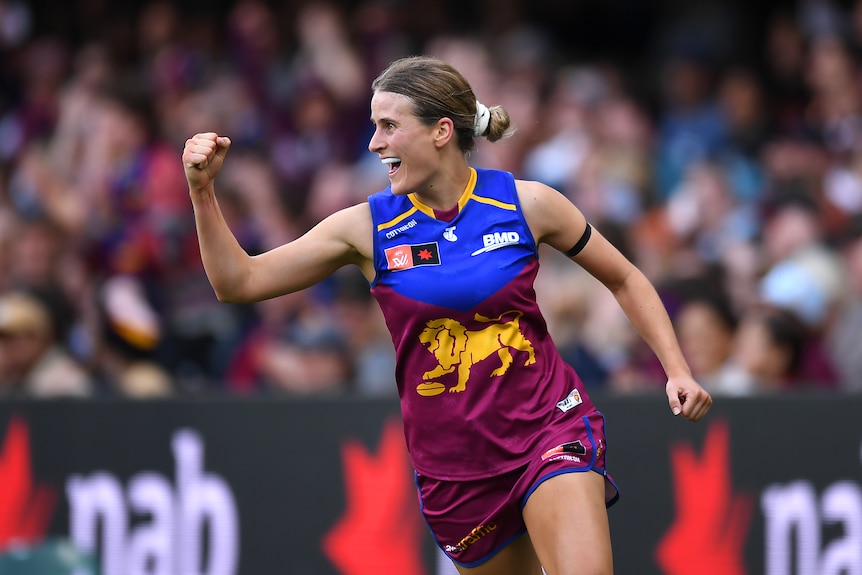 Greta Bodey smiles and pumps her fist after kicking a goal