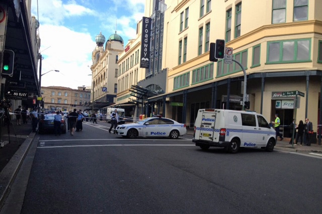 Police close a street outside the Broadway Shopping Centre in Sydney after shots fired