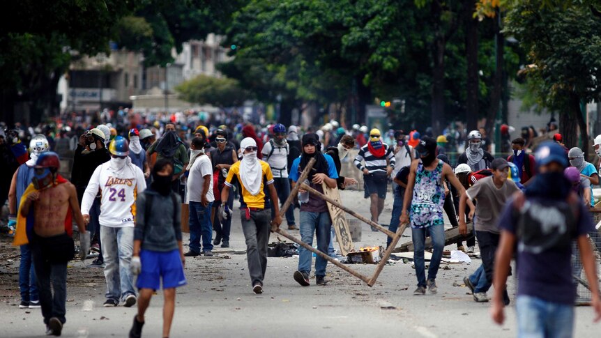 Protestors march through the street.