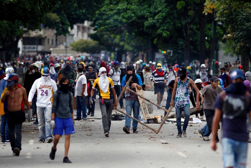 Protestors march through the street.