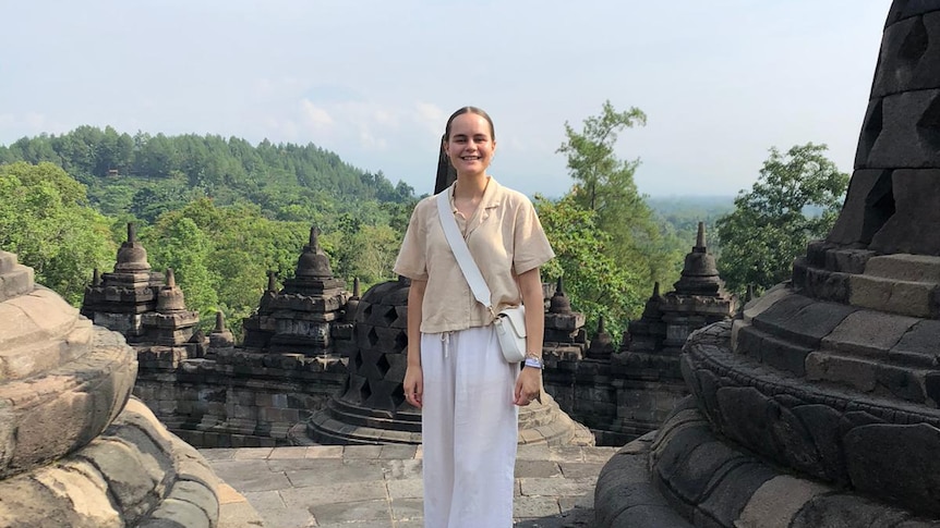 A young woman standing in the historical monument in Yogyakarta, capital city of the Central Java province.