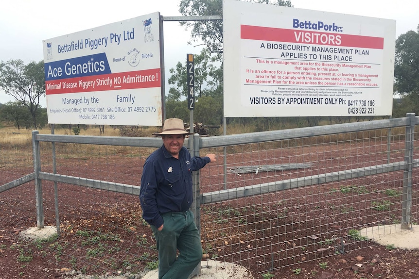 Laurie Brosnan stands at the gates of his business BettaPork in Biloela