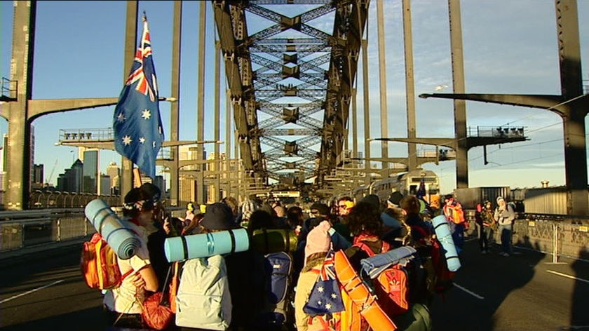 World Youth Day pilgrims walk along the Sydney Harbour Bridge on their way to Randwick racecourse