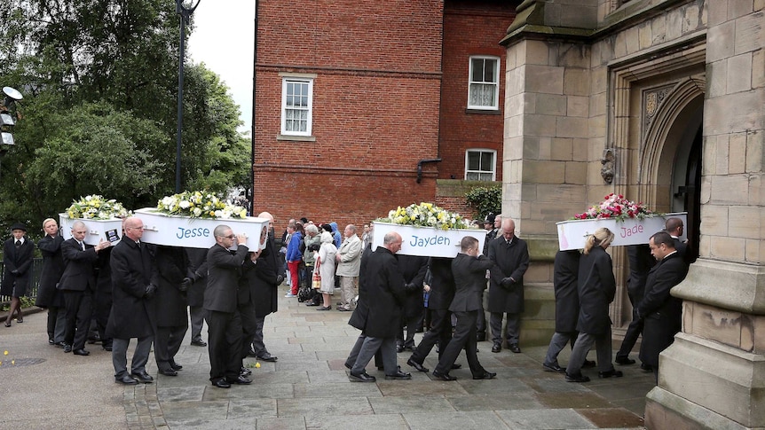 Pallbearers carry the coffins of the Philpott children into St Mary's Church in Derby.