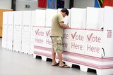 A voter at a polling booth in the Queensland election at Inala State School on Brisbane's south-west.