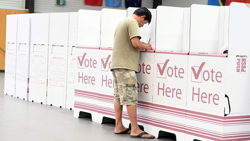 A voter at a polling booth in the Queensland election at Inala State School on Brisbane's south-west.