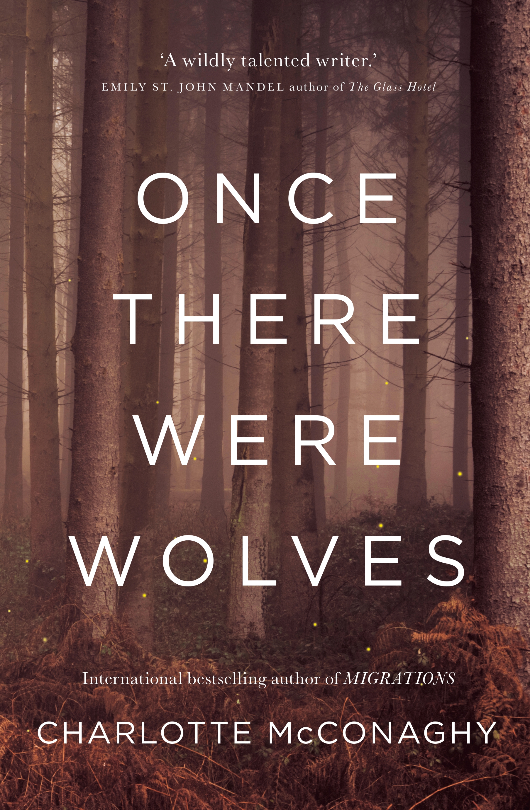 The book cover of Once There Were Wolves by Charlotte McConaghy, a faded image of a forest