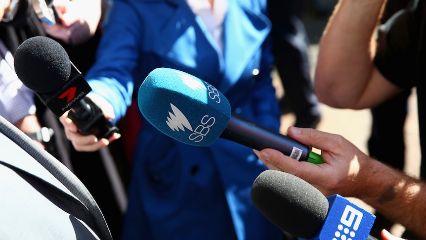 Microphones with the logos of Channel 7, SBS and Channel 9