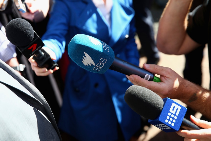 Microphones with the logos of Channel 7, SBS and Channel 9