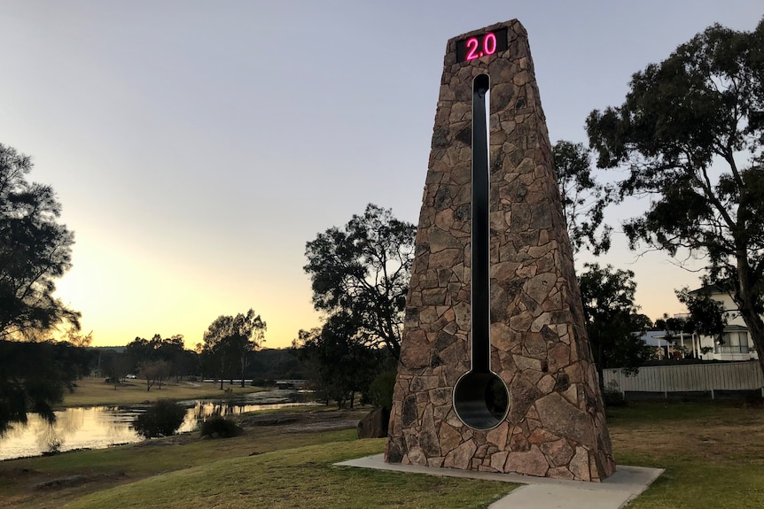 A giant model of a thermometer displaying a reading of two degrees.