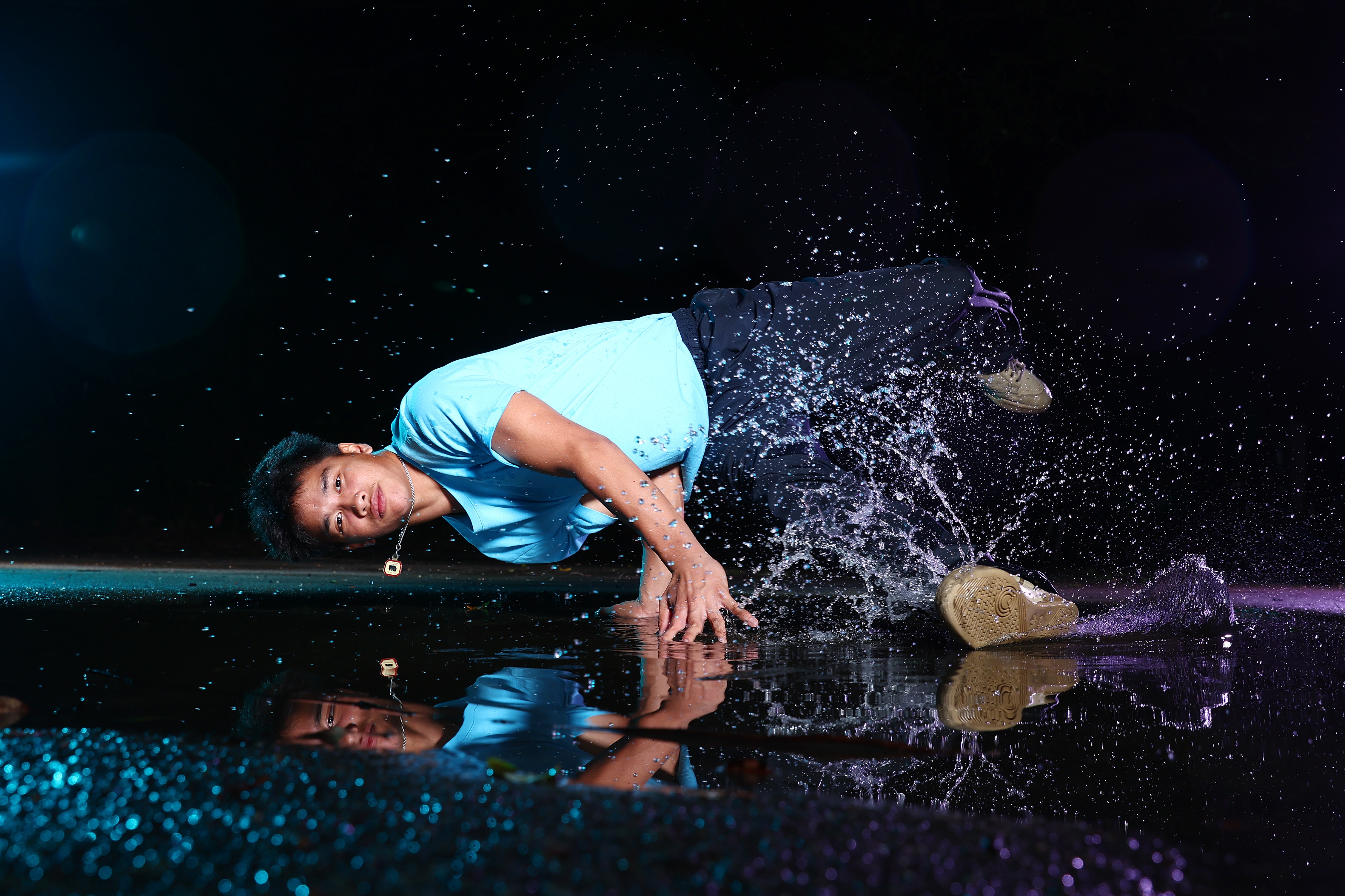 A bboy dancing in water 
