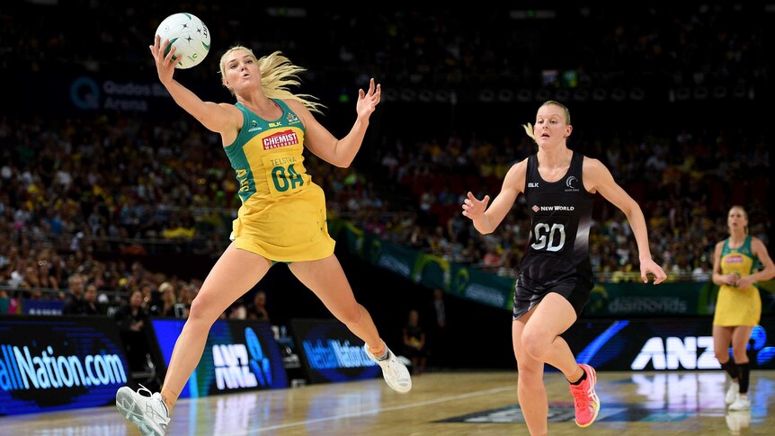 In control ... Australia's Gretel Tippett leaps for the ball against New Zealand