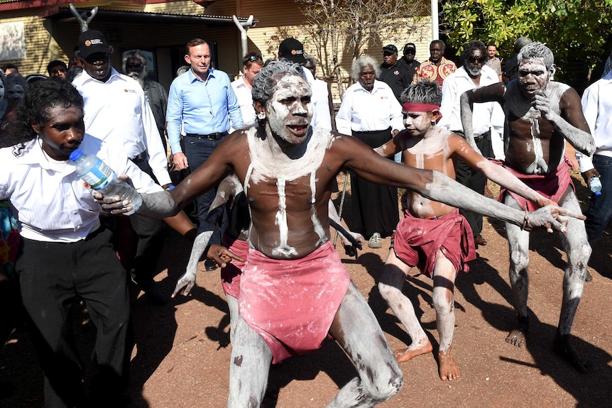 Tony Abbott is greeted by a traditional Welcome to Country ceremony at Yirrkala in North East Arnhem Land.