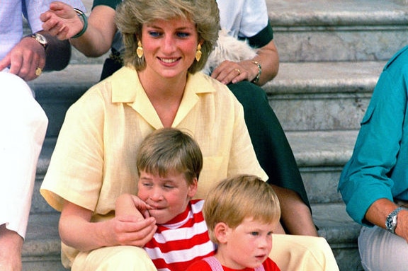 Princess Diana sits close to ger young sons, Princes William and Harry, in 1987 .