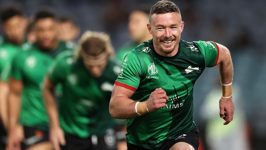 A man warms up for a rugby league match