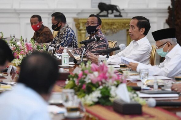Indonesian President Joko Widodo sitting alongside his cabinet.