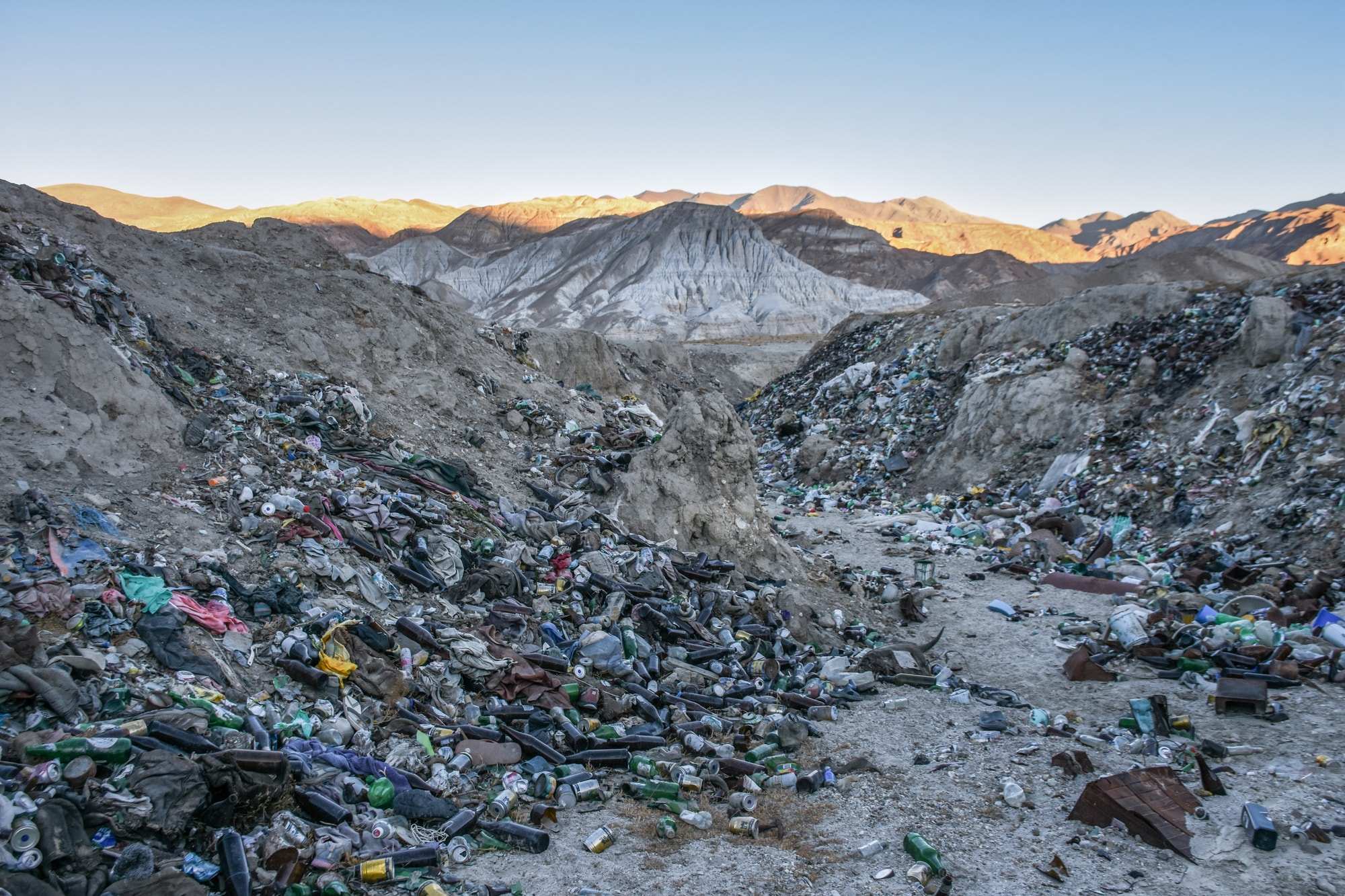 A dump full of bottles in the mountains