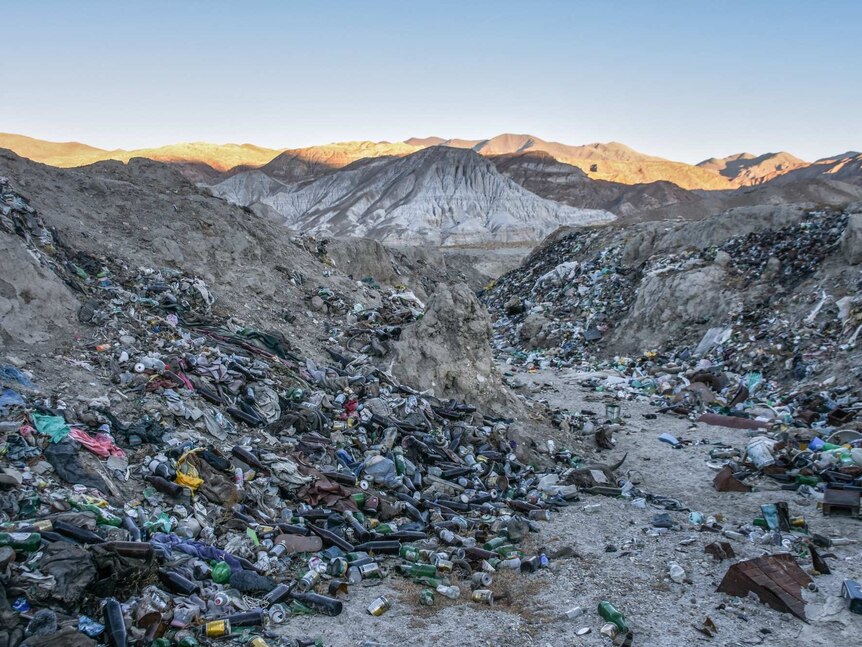 A dump full of bottles in the mountains