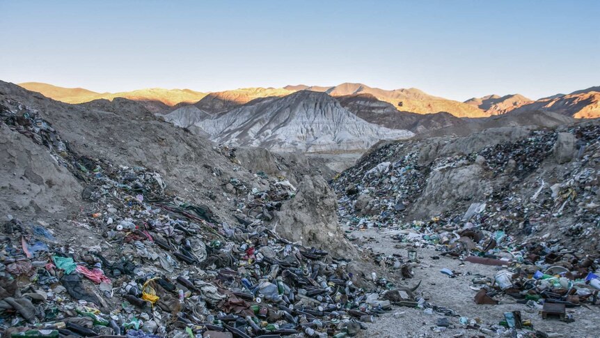 A dump full of bottles in the mountains