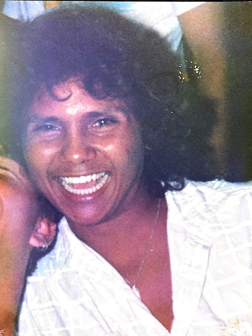 A young Aboriginal man with a large smile
