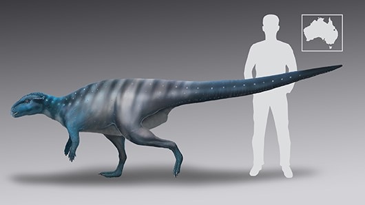 An illustration of a blue-grey dinosaur beside a human.