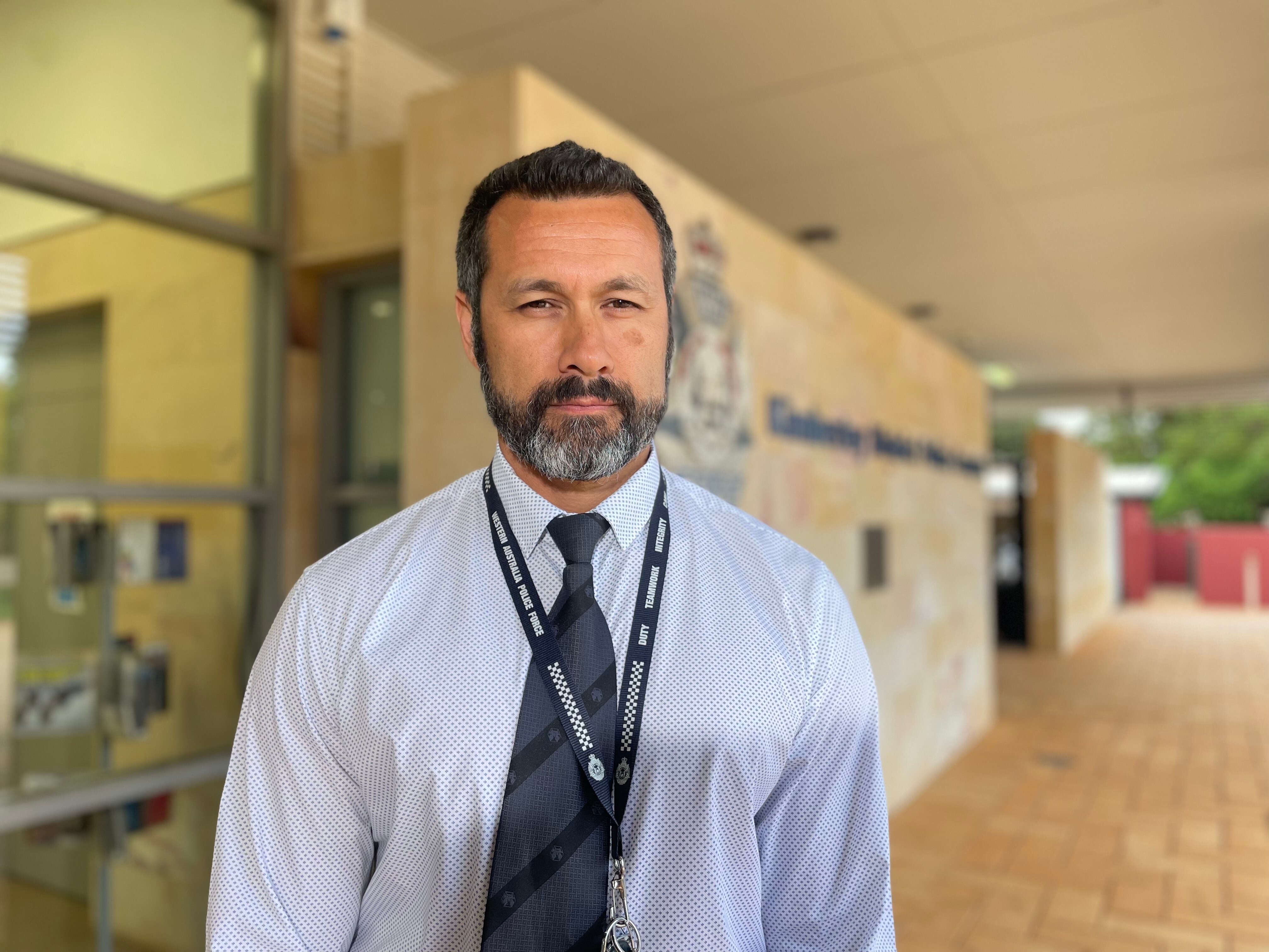 man in front of police station 