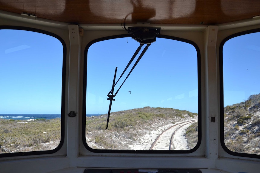 View from inside a tram running along a beach track on Rottnest Island