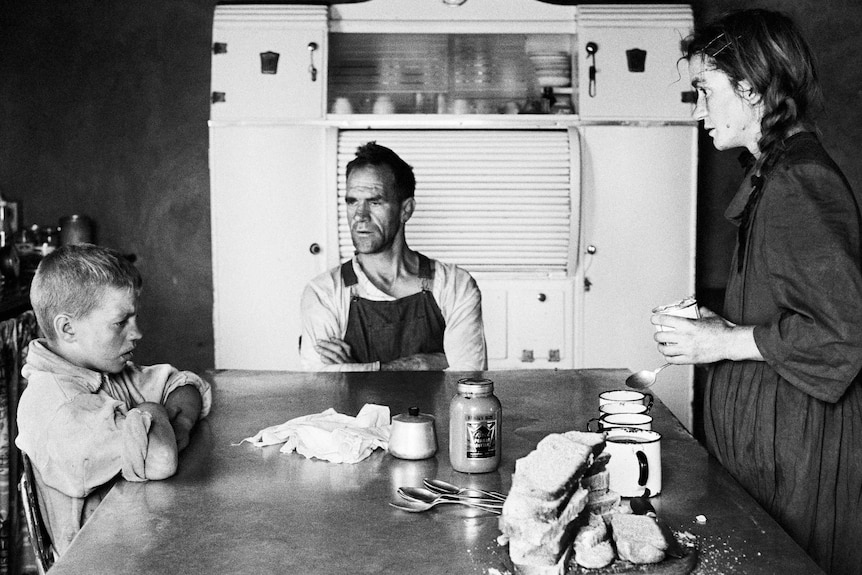 David Goldblatt: A plot-holder, his wife and their eldest son at lunch, Wheatlands, Randfontein, 1962