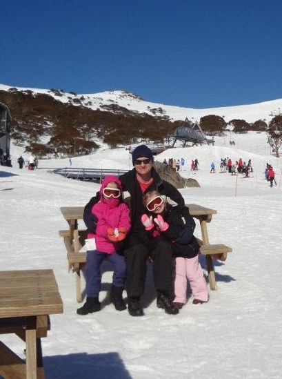 Paul Cubitt with his daughters at the snow.