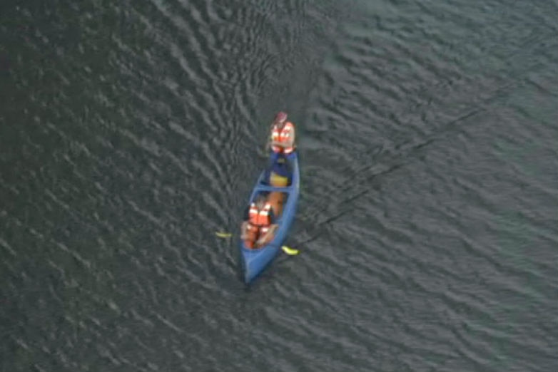 Two rescuers in a canoe.