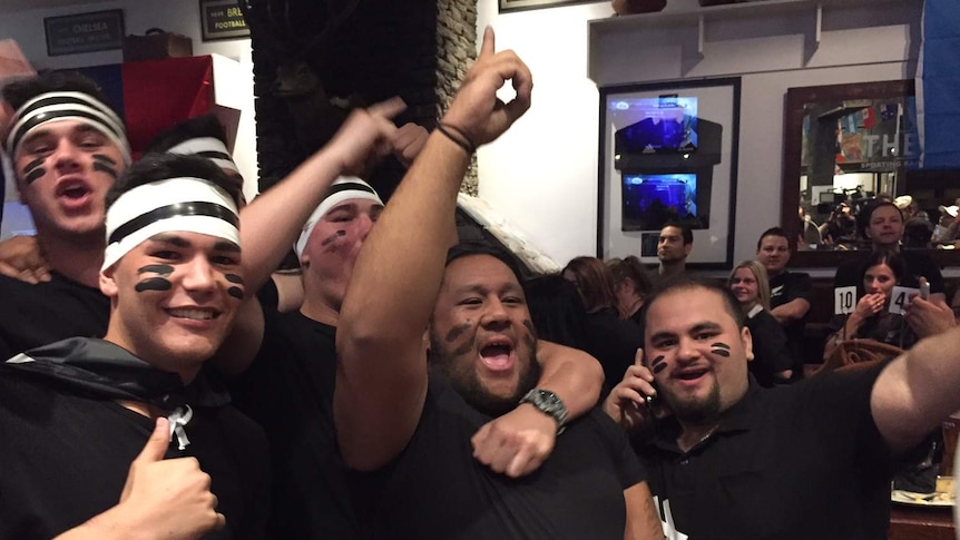 All Blacks fans celebrate after the All Black's 2015 Rugby World Cup win