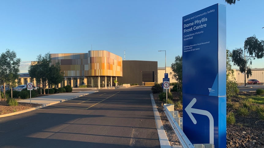 A sign and a road leading into a prison building at the Dame Phyllis Frost Centre.