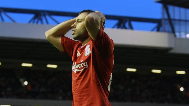 Liverpool's Javier Mascherano slumps in disappointment after the Reds' defeat.