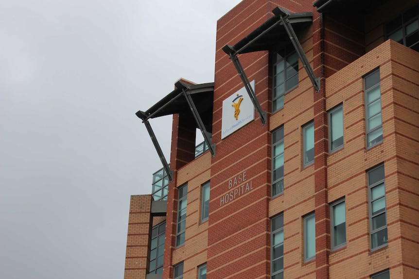 An orange brick entrance to a hospital.